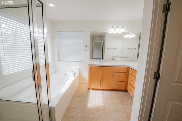 bathroom featuring recessed lighting, a shower stall, tile patterned floors, vanity, and a garden tub