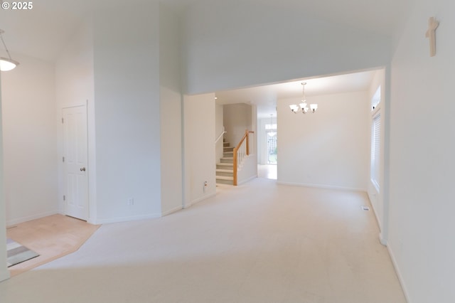 unfurnished room featuring stairway, carpet flooring, baseboards, and an inviting chandelier