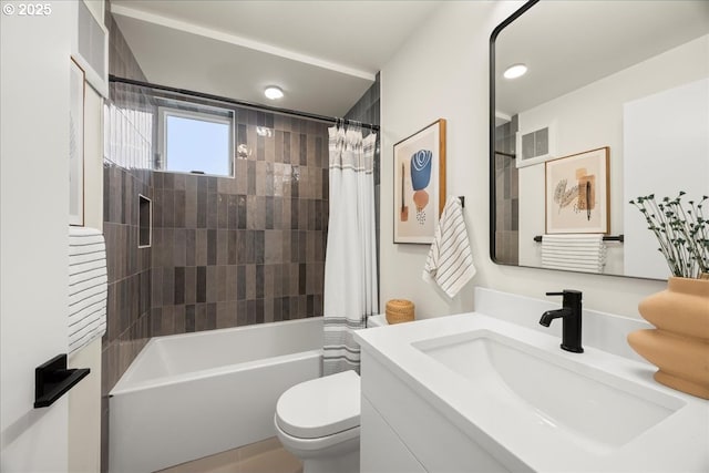 bathroom featuring visible vents, shower / bathtub combination with curtain, toilet, and vanity