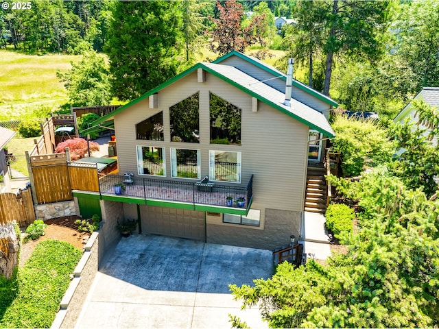 2407 Hawkins Ln, Eugene, OR 97405 - view of front of property featuring a garage, concrete driveway, and stairs