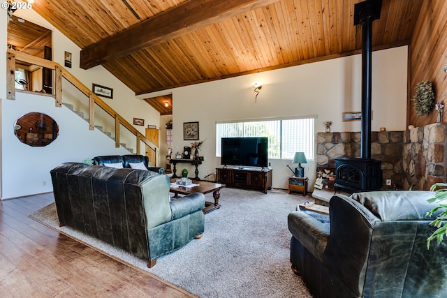 2407 Hawkins Ln, Eugene, OR 97405 - living room with a wooden ceiling with exposed beams, a wood stove, stairs, and high vaulted ceiling