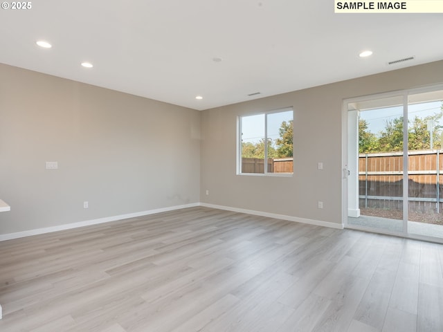 empty room featuring light hardwood / wood-style floors