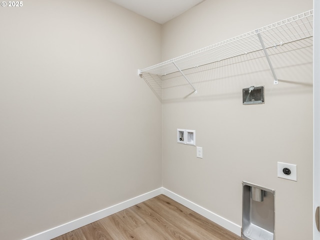 728 NW 178th Way, Ridgefield, WA 98642 - laundry area featuring hookup for a washing machine, light wood finished floors, hookup for an electric dryer, and baseboards