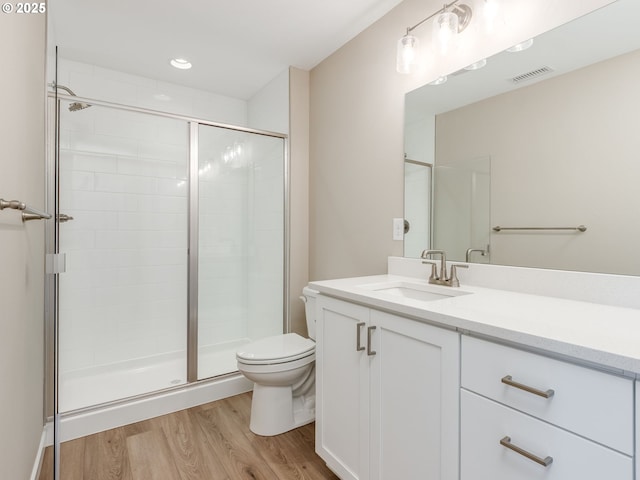 728 NW 178th Way, Ridgefield, WA 98642 - full bathroom featuring wood finished floors, toilet, a shower stall, and vanity