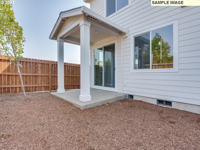 exterior space featuring visible vents and fence