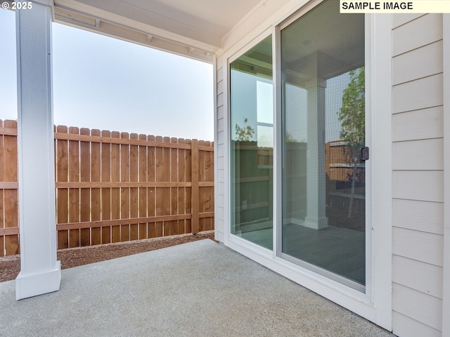 view of patio / terrace featuring fence