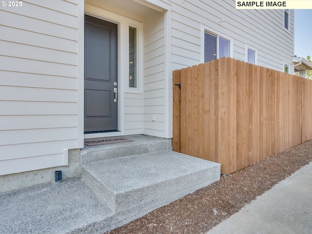 property entrance with fence