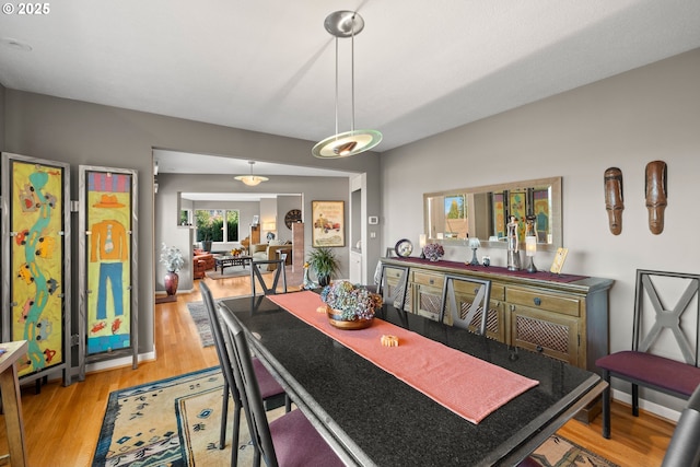 dining space featuring light hardwood / wood-style flooring