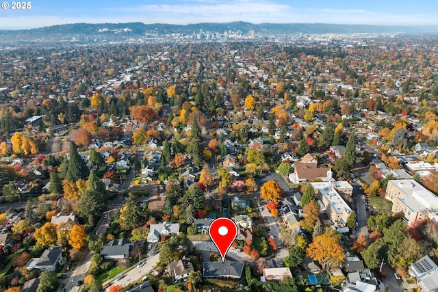 drone / aerial view featuring a mountain view