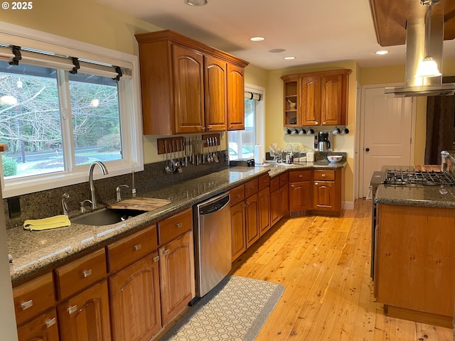 kitchen with a sink, brown cabinets, island exhaust hood, stainless steel appliances, and open shelves