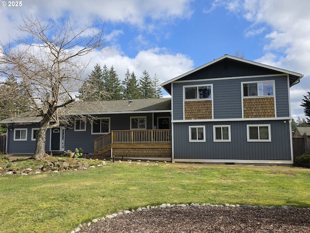 back of property featuring a deck, a lawn, and crawl space