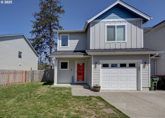 27 NW 6th Pl, Warrenton, OR 97146 - view of front of home featuring a front lawn, concrete driveway, fence, a garage, and board and batten siding
