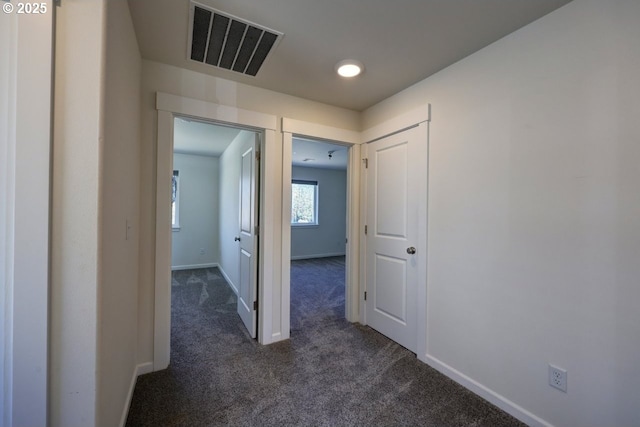 27 NW 6th Pl, Warrenton, OR 97146 - hall with baseboards, dark colored carpet, and visible vents