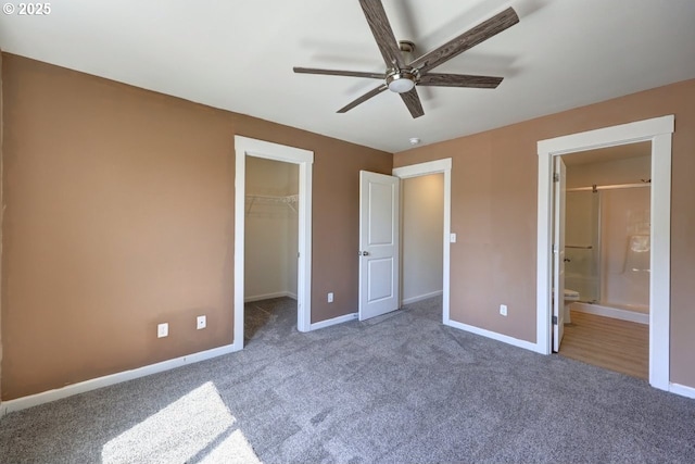 27 NW 6th Pl, Warrenton, OR 97146 - unfurnished bedroom featuring a closet, carpet floors, a spacious closet, and baseboards
