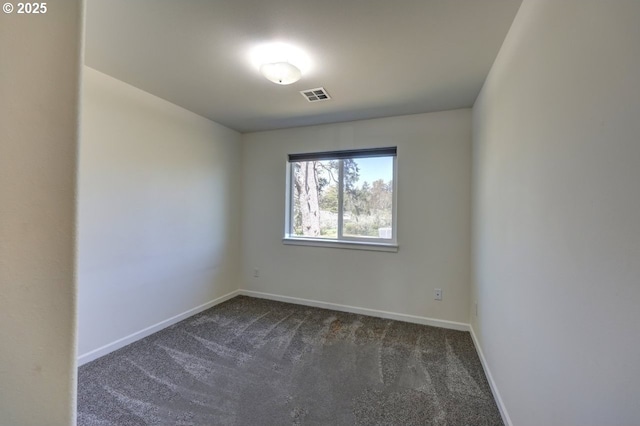 27 NW 6th Pl, Warrenton, OR 97146 - spare room with dark colored carpet, visible vents, and baseboards