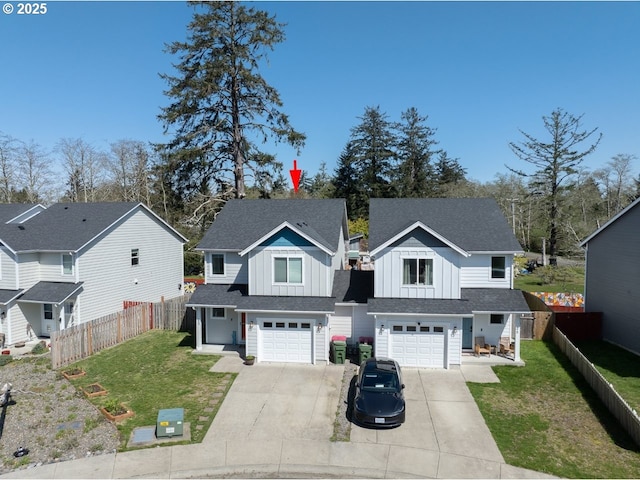 27 NW 6th Pl, Warrenton, OR 97146 - view of front of home featuring board and batten siding, driveway, a front yard, and roof with shingles