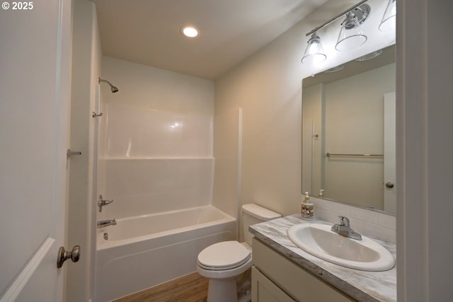 27 NW 6th Pl, Warrenton, OR 97146 - full bathroom with recessed lighting, wood finished floors, toilet, vanity, and bathtub / shower combination