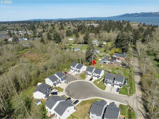 27 NW 6th Pl, Warrenton, OR 97146 - birds eye view of property with a forest view, a water and mountain view, and a residential view