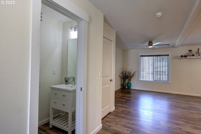 27 NW 6th Pl, Warrenton, OR 97146 - hallway featuring baseboards, wood finished floors, and a sink