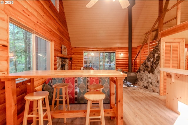 177 Northwoods, Cougar, WA 98616 - bar featuring rustic walls, wood finished floors, high vaulted ceiling, healthy amount of natural light, and ceiling fan