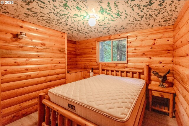 177 Northwoods, Cougar, WA 98616 - bedroom featuring wood finished floors and rustic walls