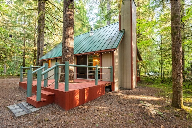 177 Northwoods, Cougar, WA 98616 - back of house featuring a chimney, a standing seam roof, metal roof, and a deck