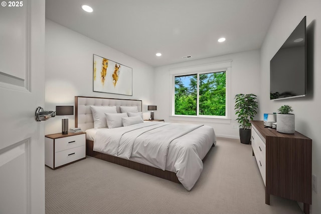 bedroom featuring light colored carpet, recessed lighting, and baseboards