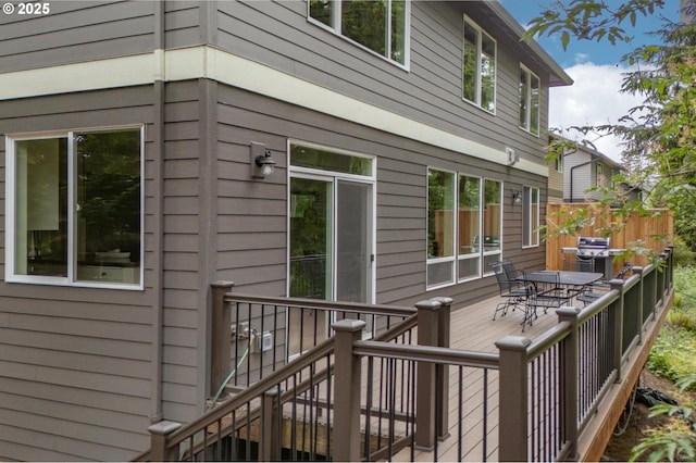 wooden terrace with outdoor dining space