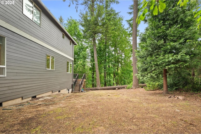 view of yard featuring stairway