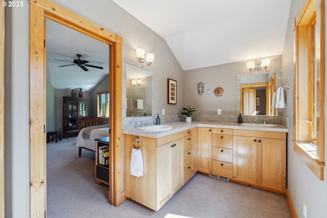165 Stadelman Dr, Trout Lake, WA 98650 - full bath with lofted ceiling, double vanity, backsplash, ceiling fan, and connected bathroom