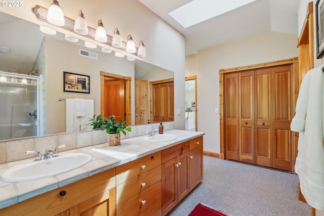 165 Stadelman Dr, Trout Lake, WA 98650 - full bath featuring a skylight, double vanity, and a stall shower