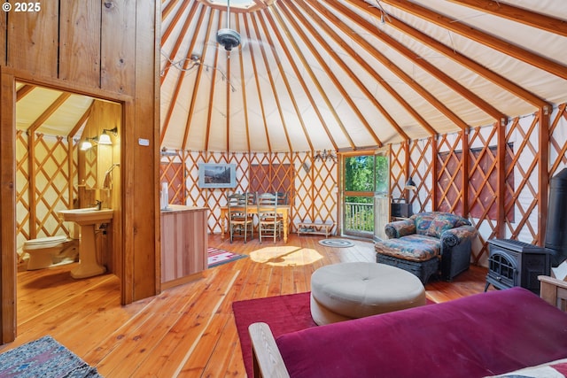 165 Stadelman Dr, Trout Lake, WA 98650 - living area featuring hardwood / wood-style floors, a wood stove, and vaulted ceiling