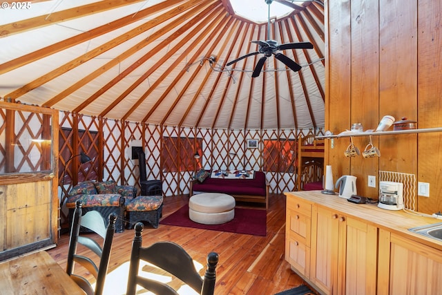165 Stadelman Dr, Trout Lake, WA 98650 - bedroom featuring light wood-style flooring and wooden walls