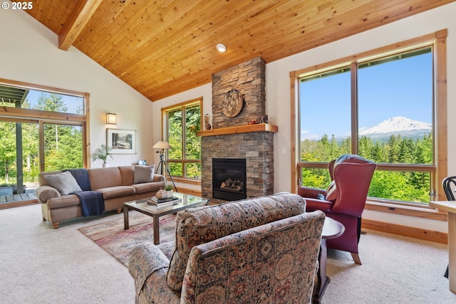 165 Stadelman Dr, Trout Lake, WA 98650 - carpeted living area featuring a wooden ceiling with exposed beams, a fireplace, high vaulted ceiling, and a mountain view