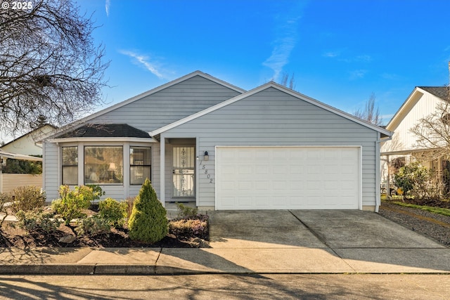 single story home featuring driveway and an attached garage