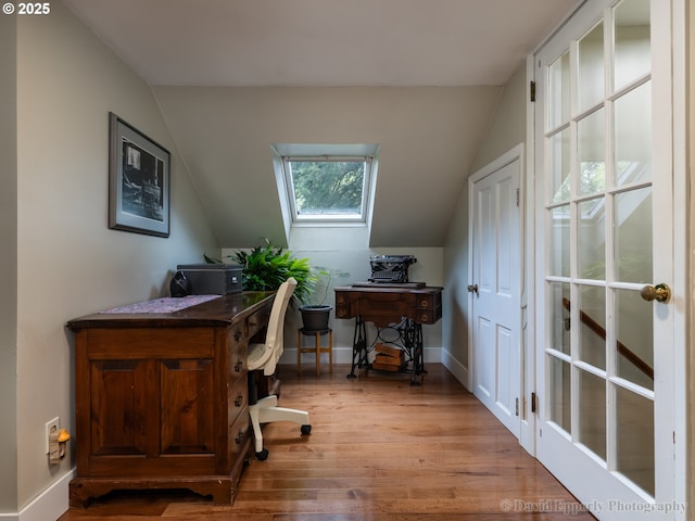 520 NE 5th St, Clatskanie, OR 97016 - home office featuring lofted ceiling, wood finished floors, and a skylight