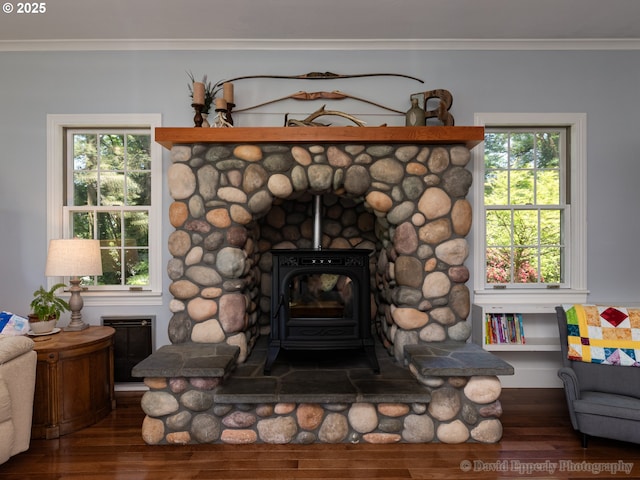 520 NE 5th St, Clatskanie, OR 97016 - detailed view of wood finished floors, ornamental molding, and a wood stove