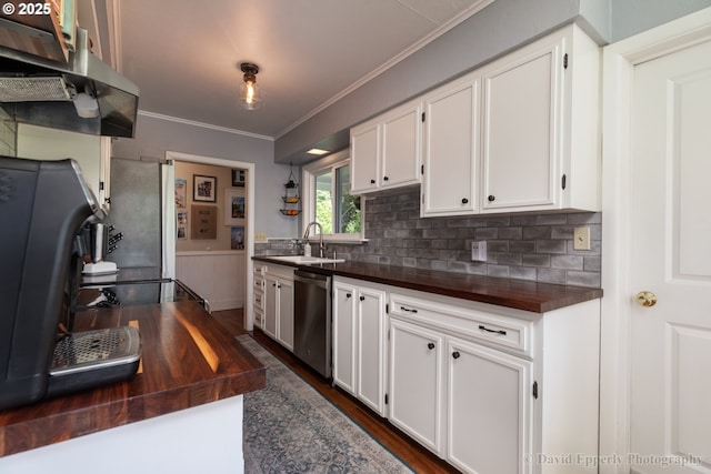 520 NE 5th St, Clatskanie, OR 97016 - kitchen featuring stainless steel dishwasher, wooden counters, crown molding, white cabinets, and dark wood finished floors