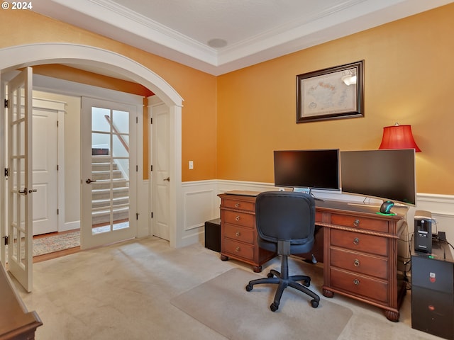 office area featuring french doors, light colored carpet, and crown molding