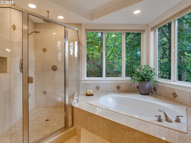 bathroom with separate shower and tub and crown molding