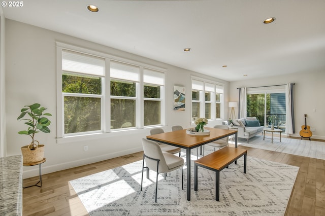 dining area with baseboards, recessed lighting, and light wood-style flooring