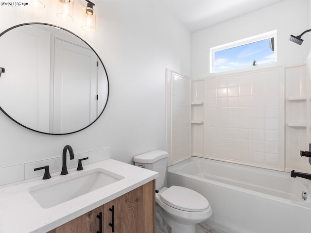 bathroom featuring toilet, bathtub / shower combination, and vanity