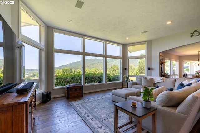 33685 Van Duyn Rd, Eugene, OR 97408 - living area with a chandelier, recessed lighting, wood-type flooring, and baseboards