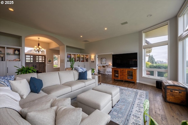 33685 Van Duyn Rd, Eugene, OR 97408 - living room with arched walkways, a chandelier, hardwood / wood-style floors, and recessed lighting