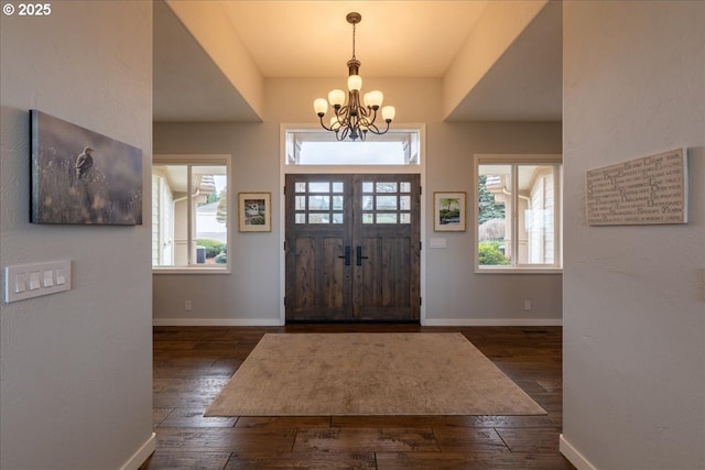 33685 Van Duyn Rd, Eugene, OR 97408 - foyer entrance featuring dark wood-style floors, a chandelier, and baseboards