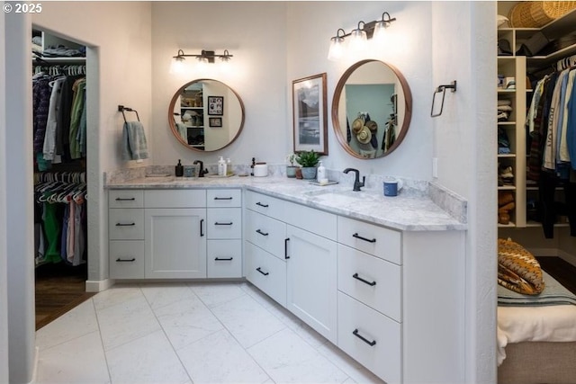 33685 Van Duyn Rd, Eugene, OR 97408 - full bathroom with double vanity, a walk in closet, and marble finish flooring