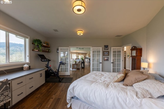 33685 Van Duyn Rd, Eugene, OR 97408 - bedroom with french doors and dark wood-style floors