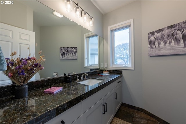 33685 Van Duyn Rd, Eugene, OR 97408 - bathroom with vanity, baseboards, and stone finish floors