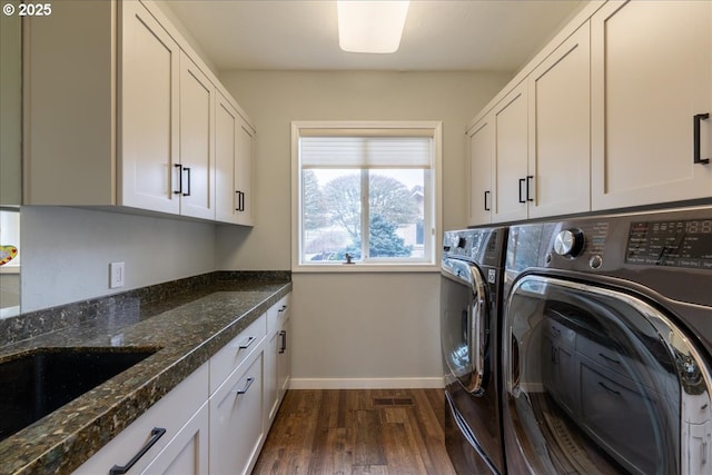 33685 Van Duyn Rd, Eugene, OR 97408 - laundry room featuring washer and clothes dryer, cabinet space, dark wood-style floors, and baseboards