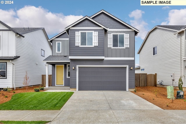 view of front facade featuring board and batten siding, concrete driveway, fence, and an attached garage